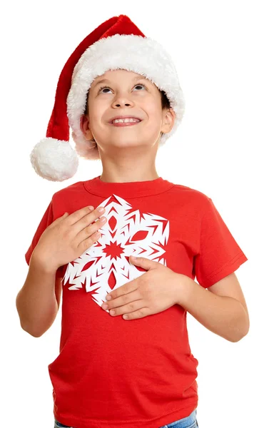 Winter holiday christmas concept - boy in santa hat portrait with big snowflake on white isolated — Φωτογραφία Αρχείου