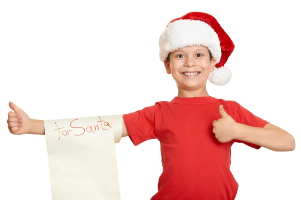 Ragazzo in cappello rosso con lunga lettera di pergamena con desideri a Babbo Natale — Foto Stock