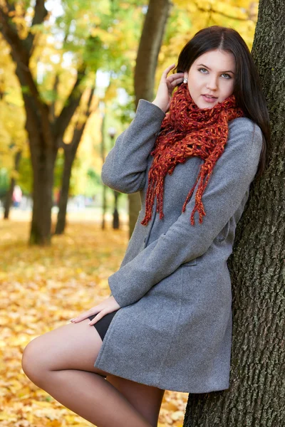Girl portrait with red scarf in autumn city park, fall season — Stock Photo, Image