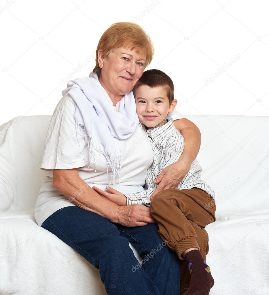 portrait of child boy and grandmother on white, happy family concept