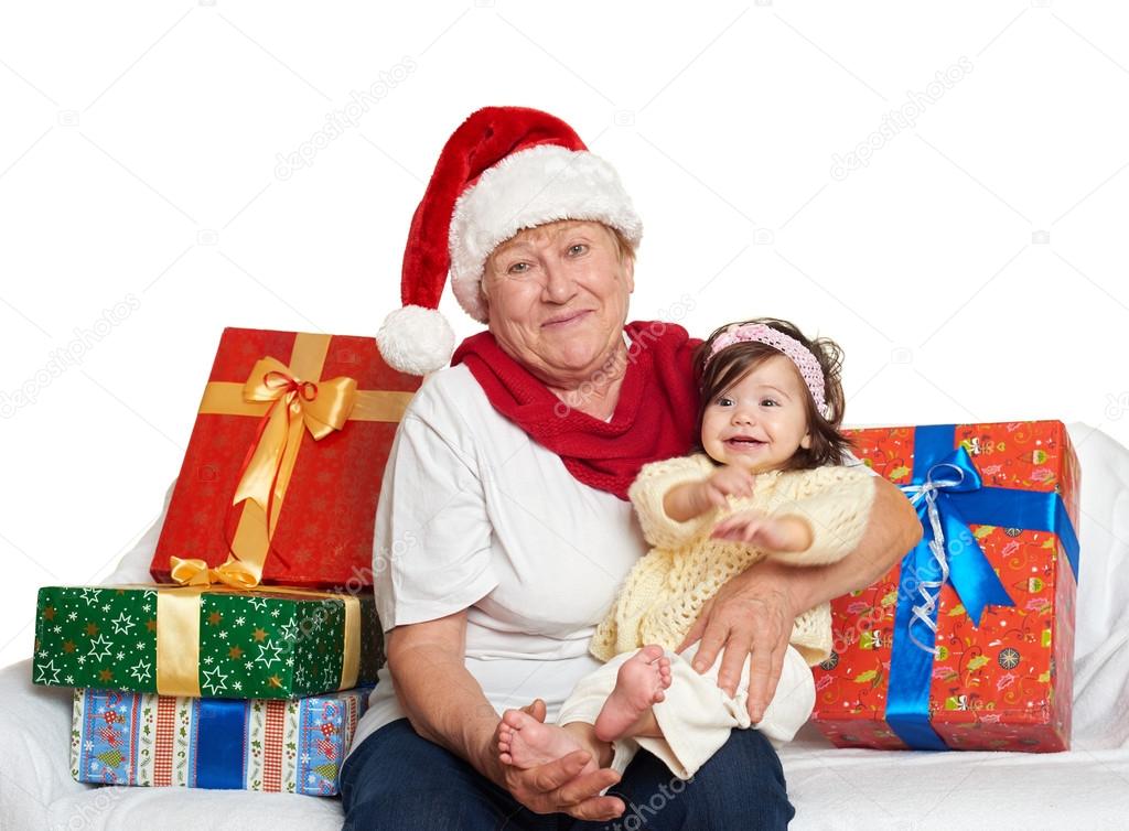 happy grandmother and granddaughter with christmas box gift - holiday concept