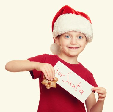 Çerezler - kış tatil Noel kavramı ile Noel Baba şapkalı kız