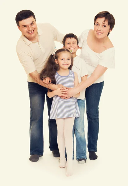 Família feliz no estúdio — Fotografia de Stock