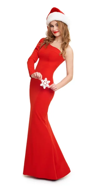 Mädchen in rotem Kleid und Weihnachtsmütze, weißer Hintergrund — Stockfoto