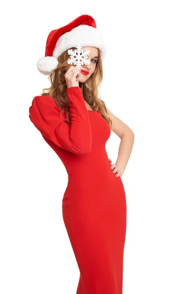 Mädchen in rotem Kleid und Weihnachtsmütze, weißer Hintergrund — Stockfoto