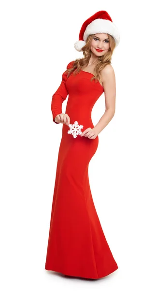 Mädchen in rotem Kleid und Weihnachtsmütze, weißer Hintergrund — Stockfoto