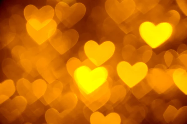 Barva pozadí fotografie zlaté srdce — Stock fotografie