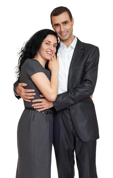 Pareja feliz vestida con ropa clásica, retrato en el estudio en blanco — Foto de Stock