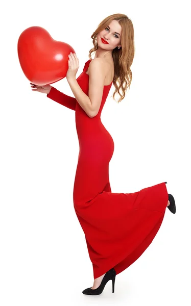 Woman in red with heart shape balloon — Stock Photo, Image