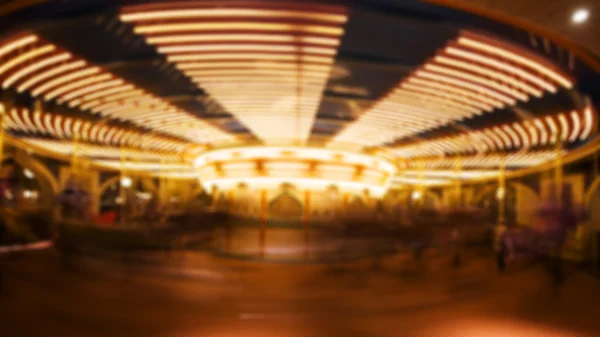 Motion blurred photo of carousel or  merry-go-round — Stock Photo, Image