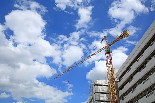 Yellow crane at construction site — Stock Photo, Image