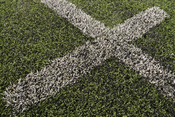 Gefälschtes Gras Fußballfeld strukturierten Hintergrund — Stockfoto