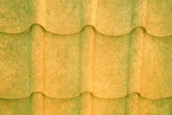 Grained yellow and green metal roof — Stock Photo, Image