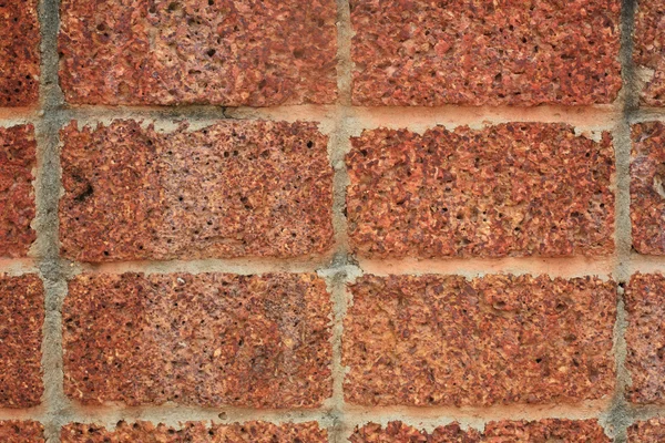 Parede de tijolo de pedra laterite vermelho — Fotografia de Stock
