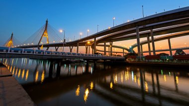 Bhumibol Bridge at dusk in Bangkok clipart