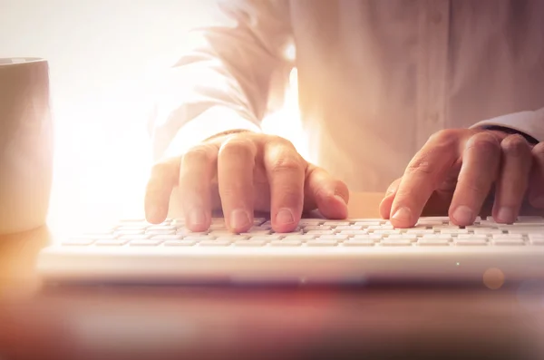Closeup of man's hands typing on keyboard — Stock Photo, Image