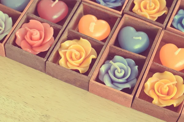 Rose candles and heart shape candles in wooden box ;vintage filt — Stock Photo, Image