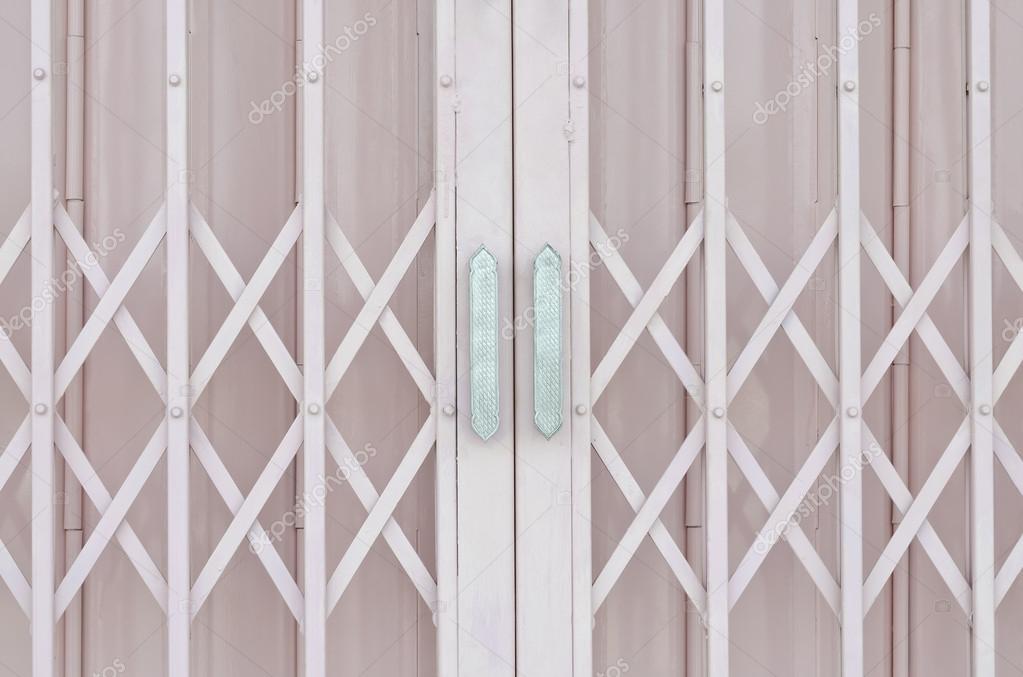 Pink Metal Grille Sliding Door With Aluminium Handle Stock Photo