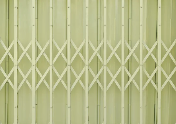 Yellow metal grille sliding door — Stock Photo, Image