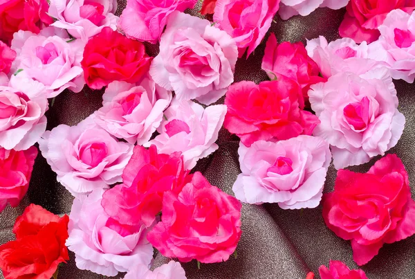 Rosa artificiale fiore su texture glitter — Foto Stock