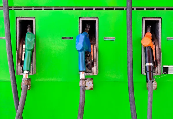 Petro pump nozzles at service station — Stock Photo, Image