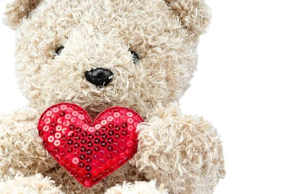 Lovely bear doll holding red heart shape — Stock Photo, Image