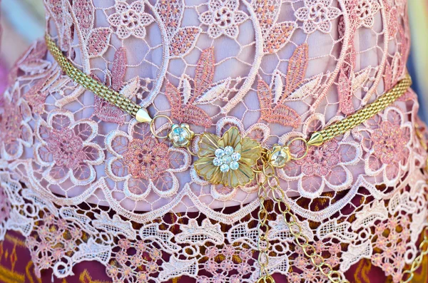 Beautiful golden belt on pink lace dress — Stock Photo, Image