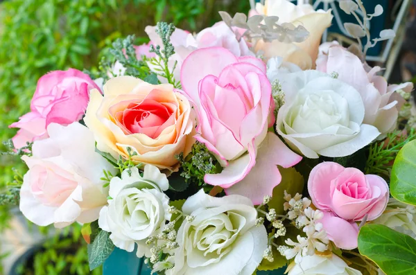 Artificial pink orange and white rose flowers bouquet — Stock Photo, Image