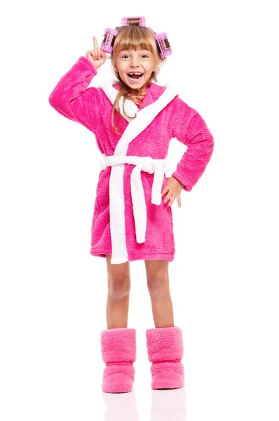 Little girl in pink bathrobe with curlers — Stock Photo, Image