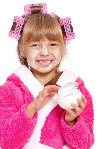 Little girl in pink bathrobe with curlers — Stock Photo, Image