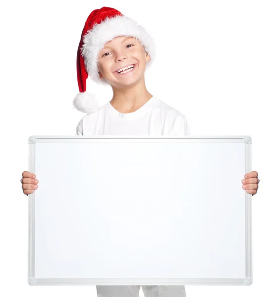 Niño en sombrero de Santa con tablero en blanco —  Fotos de Stock