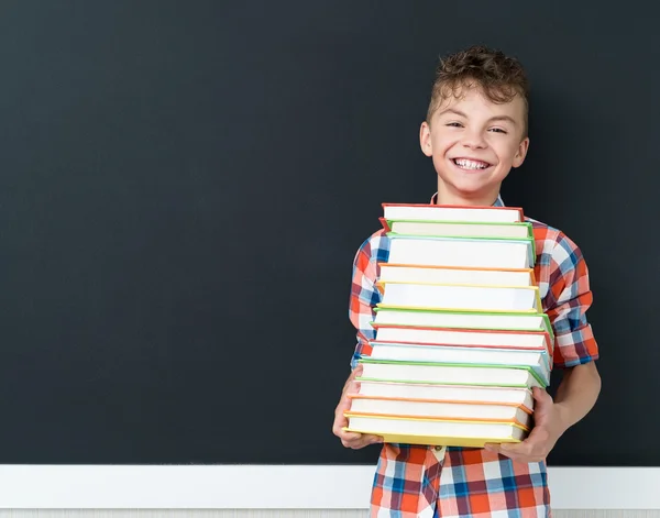 Back to school concept - schoolboy with books — Stock Photo, Image