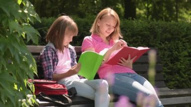 Mother and daughter reading books