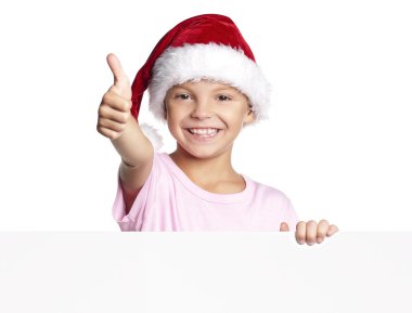 Noel Baba şapkalı çocuk