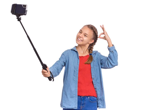 Tiener meisje met selfie stick Stockfoto