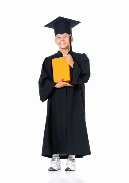 Happy graduate boy student in mantle with book — Stock Photo, Image