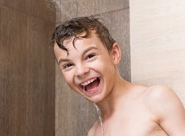 Cheerful boy washing body in bath — Stock Photo, Image