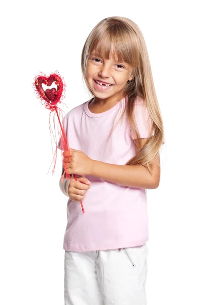 Beautiful little girl with heart — Stock Photo, Image