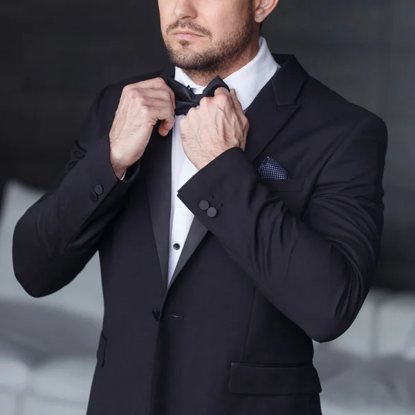 Sexy man dressing tuxedo and suit closeup — Stock Photo, Image