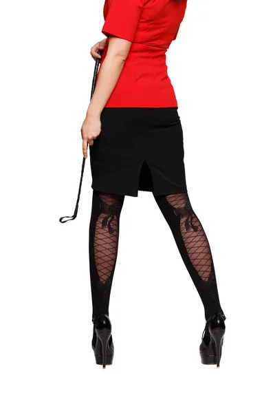 Sexy mulher corpo no vermelho terno saia e chicote isolado — Fotografia de Stock