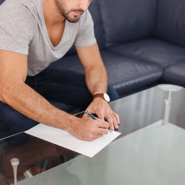 Casual white man write on blank paper — Stock Photo, Image