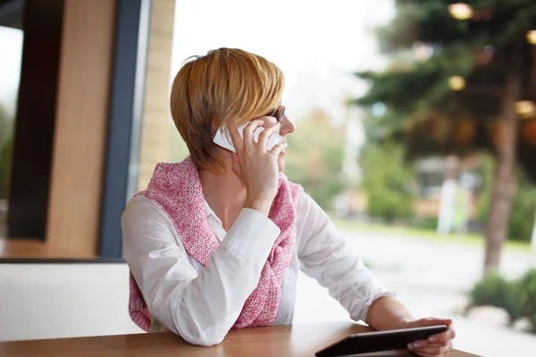 Young businesswoman call in restaurant look away — Stock Photo, Image