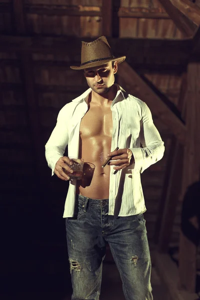 Sexy cowboy in barn — Stock Photo, Image