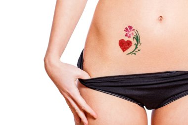 Woman with heart shaped glitter-tattoo isolated