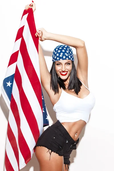 Sexy woman holding usa flag in headscarf — Stock Photo, Image