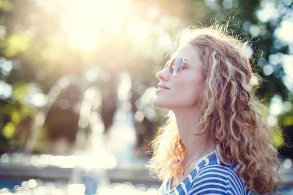 Carefree young readhead woman in park vintage — Stock Photo, Image