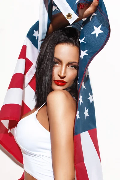 Sexy brunette woman holding USA flag — Stock Photo, Image