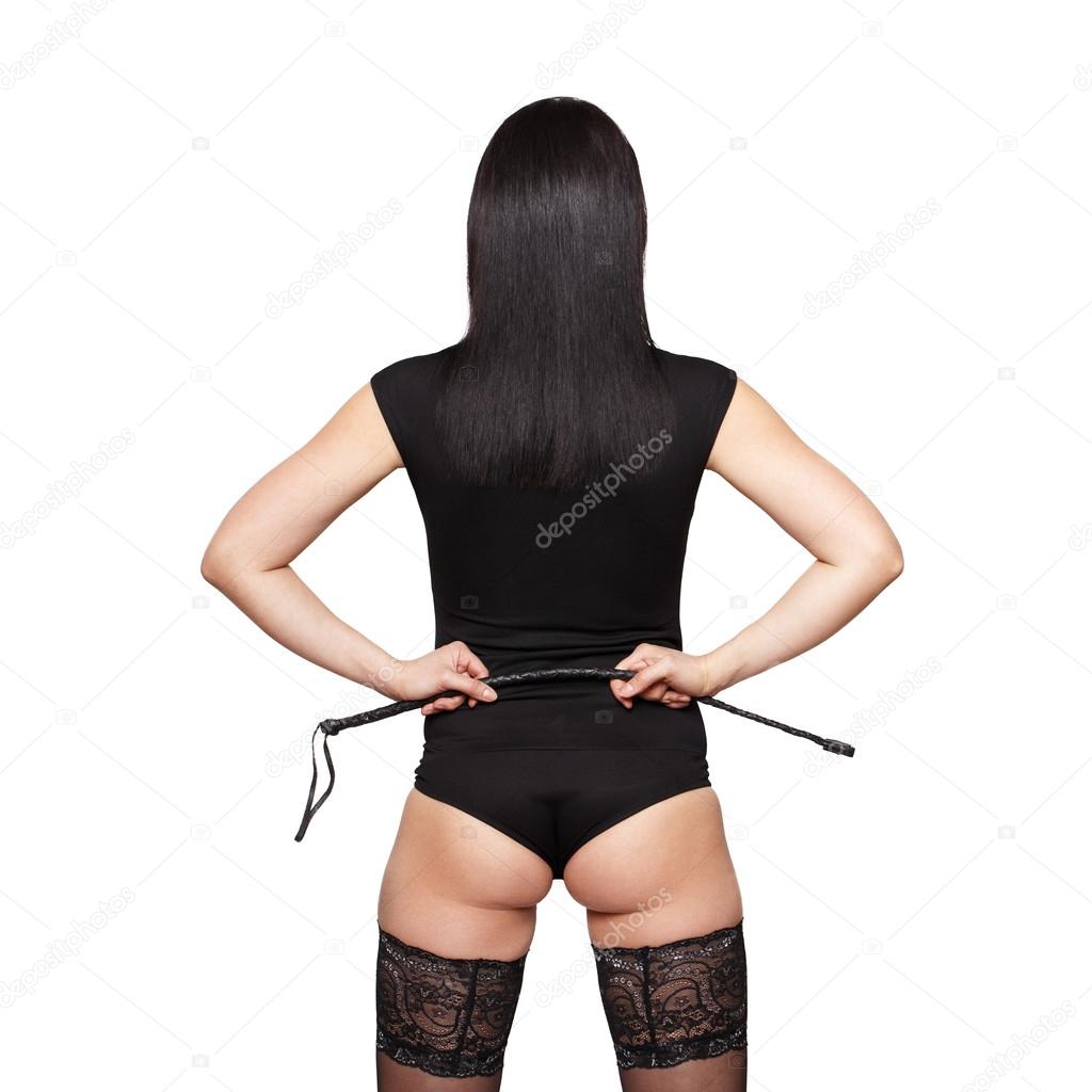 Sexy brunette woman holding whip back view