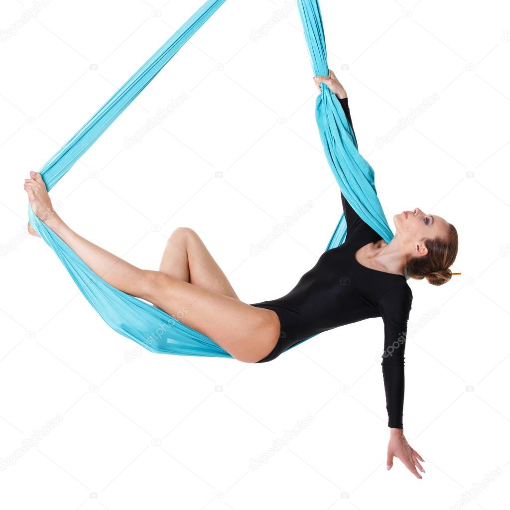Woman hanging in aerial silk