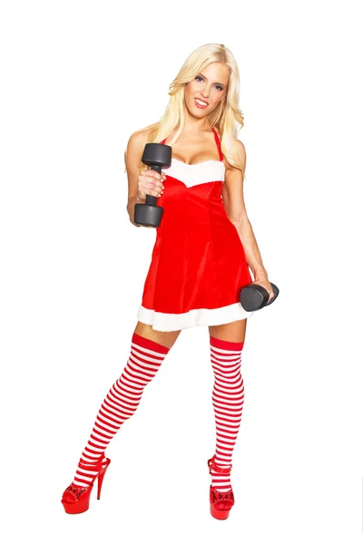 Sexy santa woman with dumbbells — Stock Photo, Image